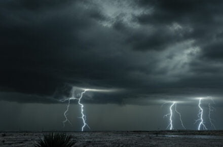 lightning storm over field in oklahoma CY62AUV